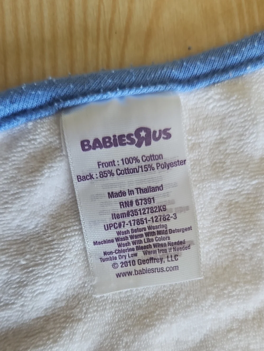 BabiesRUs Striped Bib with Blue Trim and Multicolor Lines